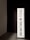 A vertically oriented lightbox displays the text 'DREAMS HAVE NO TITLES' in bold, black uppercase letters on a white background. The lightbox is positioned in a dimly lit space, creating a stark contrast between the illuminated sign and the dark surroundings.
