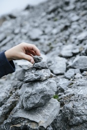 a hand holding a rock