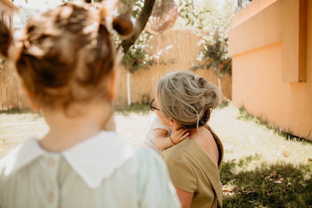 a person holding a child