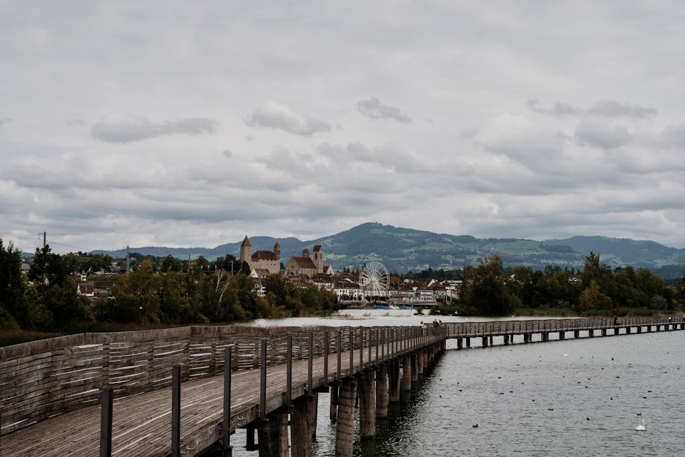 a body of water with a bridge and buildings along it