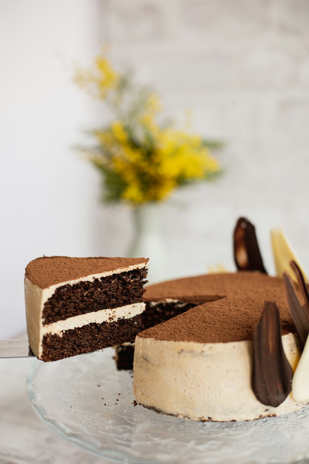 a slice of cake with a flower on top