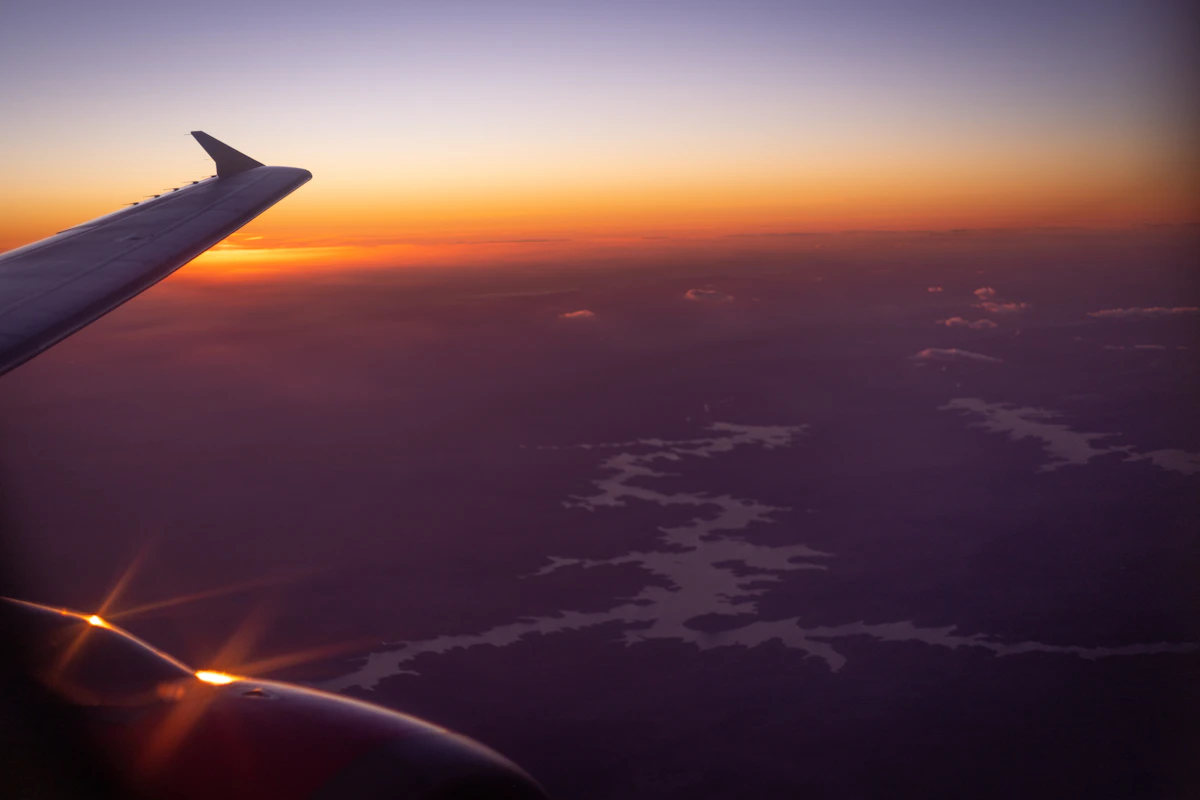 An airplane wing in the sky