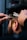 A close-up of a well-groomed beard being trimmed by a barber.