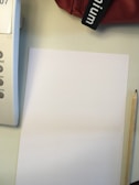 A sample application letter displayed on a clean desk with a pen.