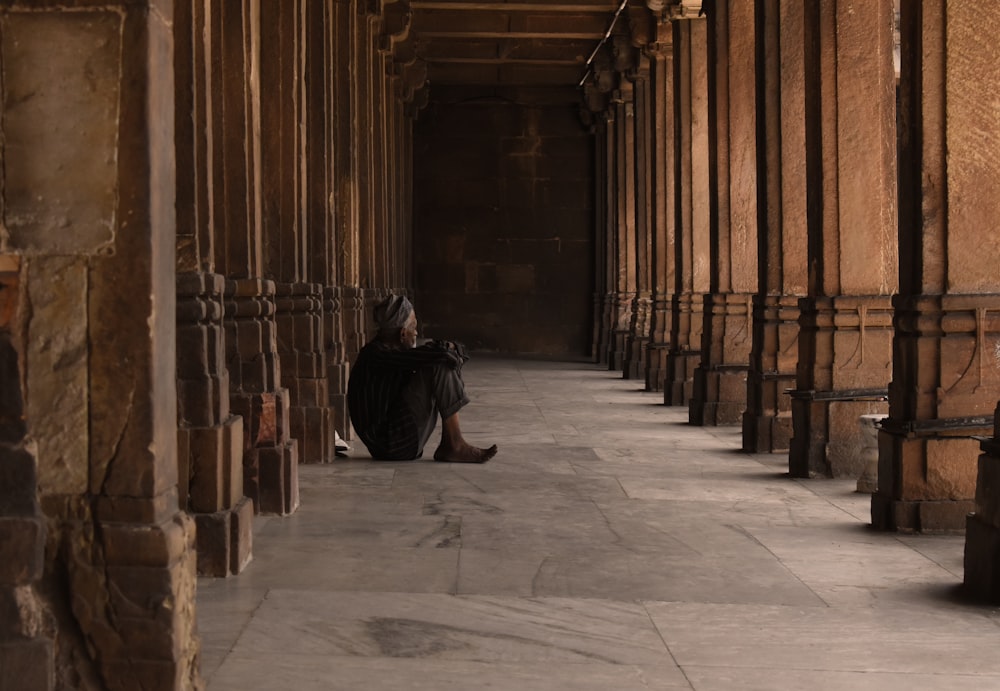 a person squatting in a room