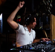 DJ Shakes mixing tracks with energy and focus at the turntables.