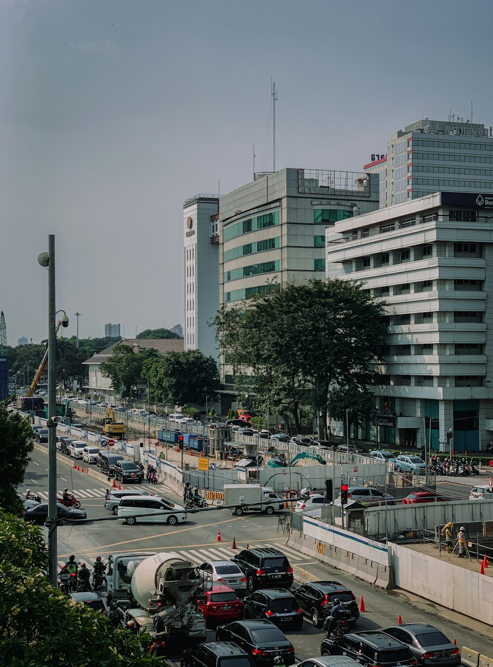 a parking lot with cars and buildings