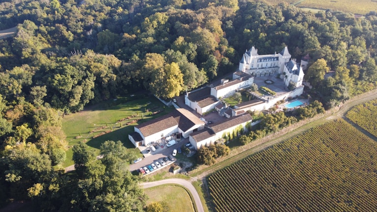 a large building surrounded by trees