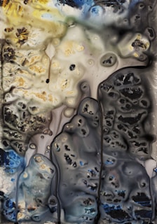 Abstract waves of color flowing together, evoking a calm yet dynamic energy.