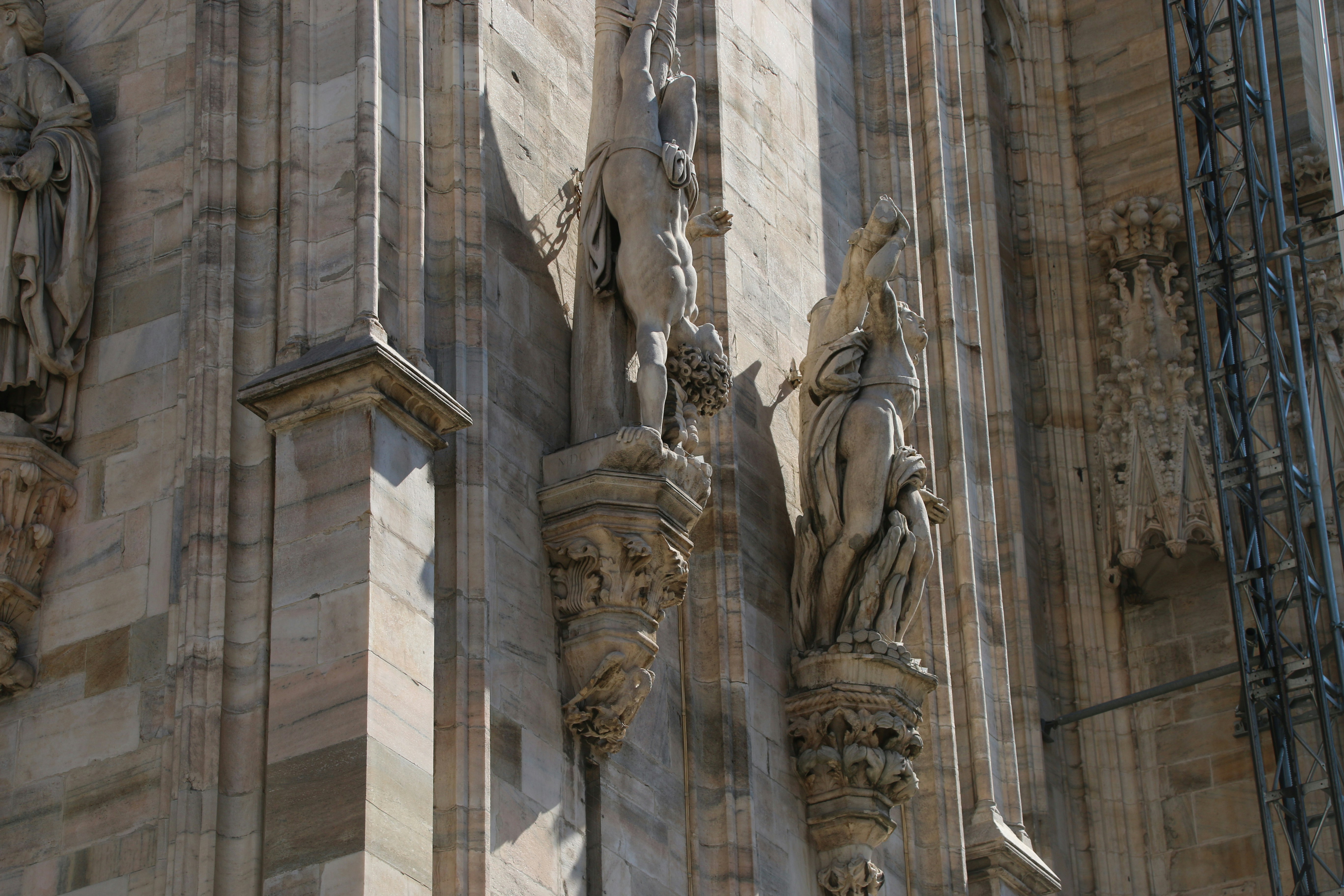 a building with statues on the side