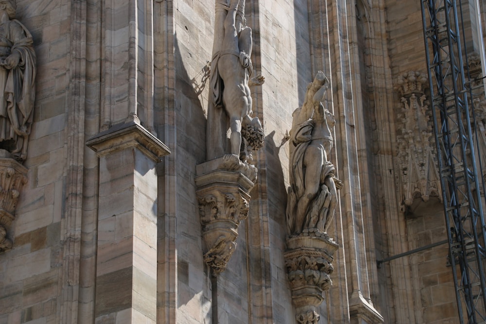 a building with statues on the side