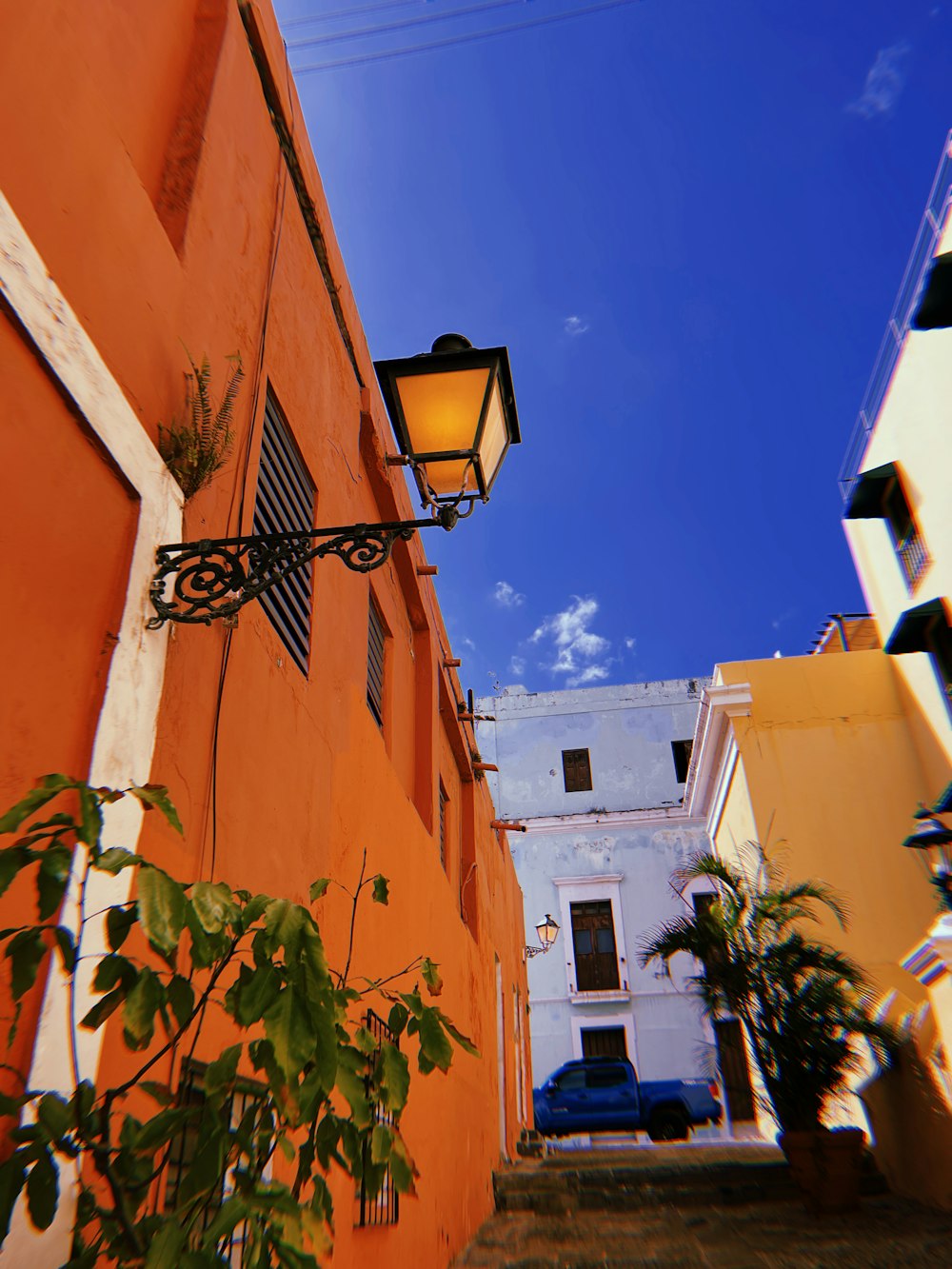 a street with buildings and a lamp post