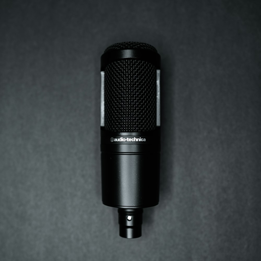 a black microphone with a black stand