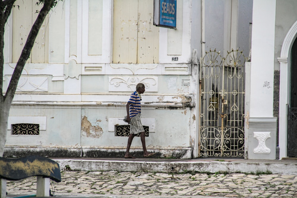 a person walking on a sidewalk