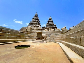 a stone wall with a statue on top of it