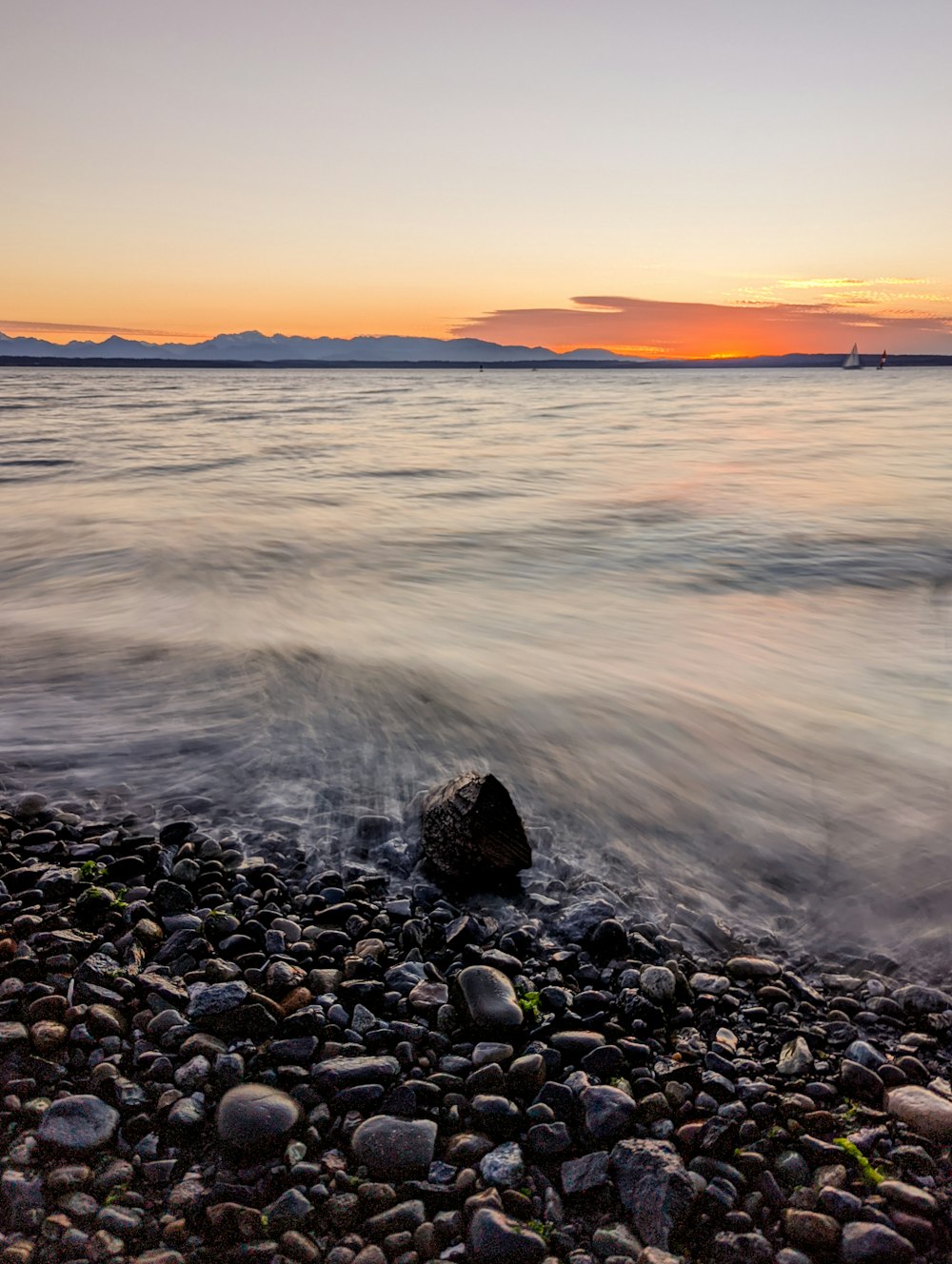 a rocky beach with waves crashing