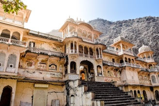 a building with a mountain in the background
