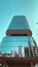 a tall building with a glass front