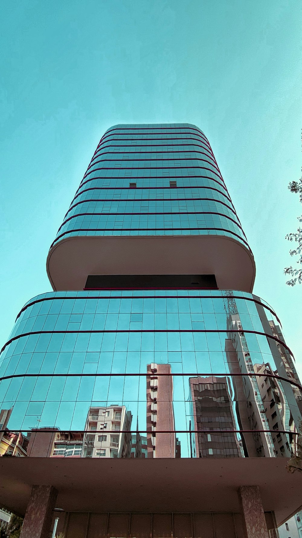 a tall building with a glass front