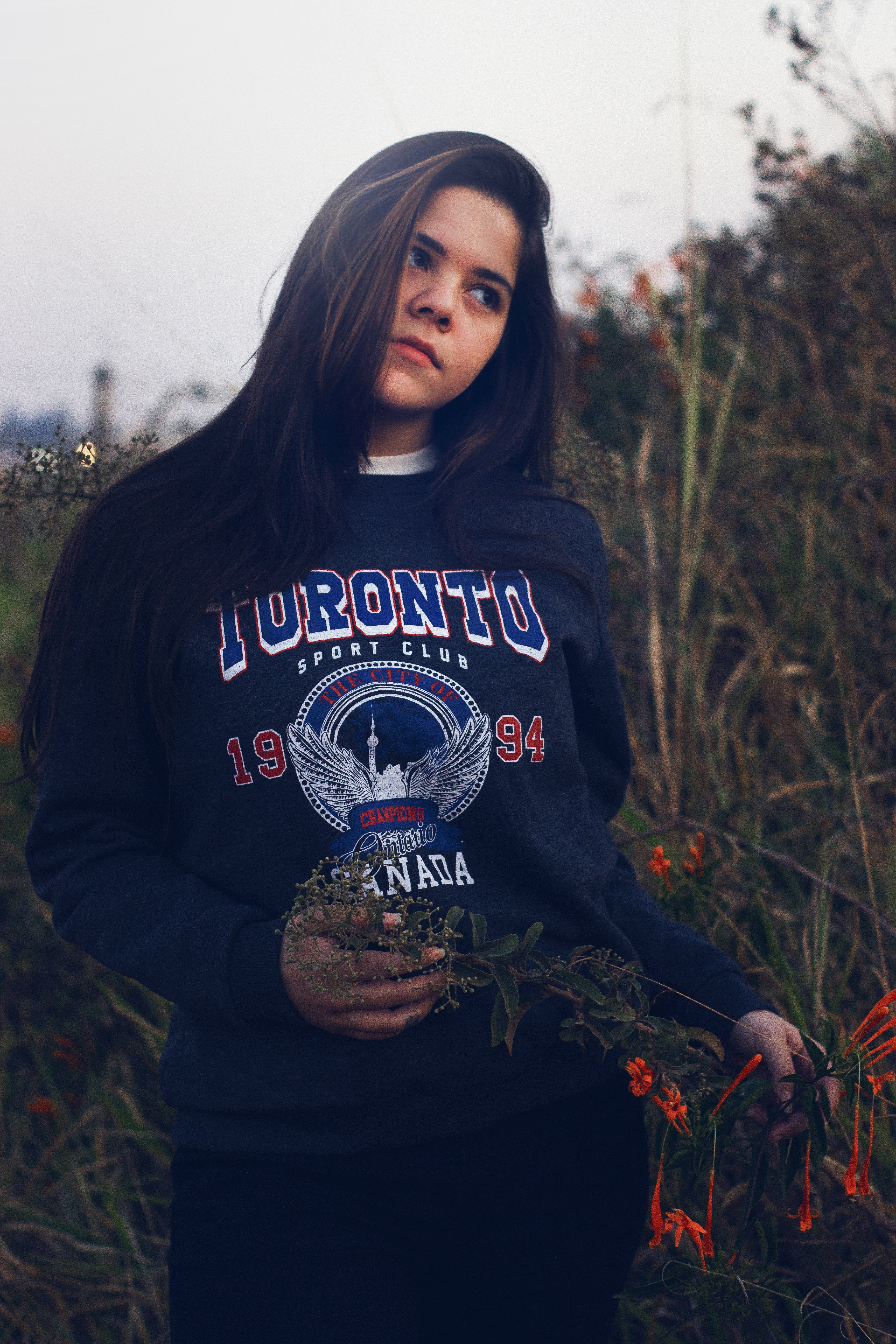 a woman holding a plant
