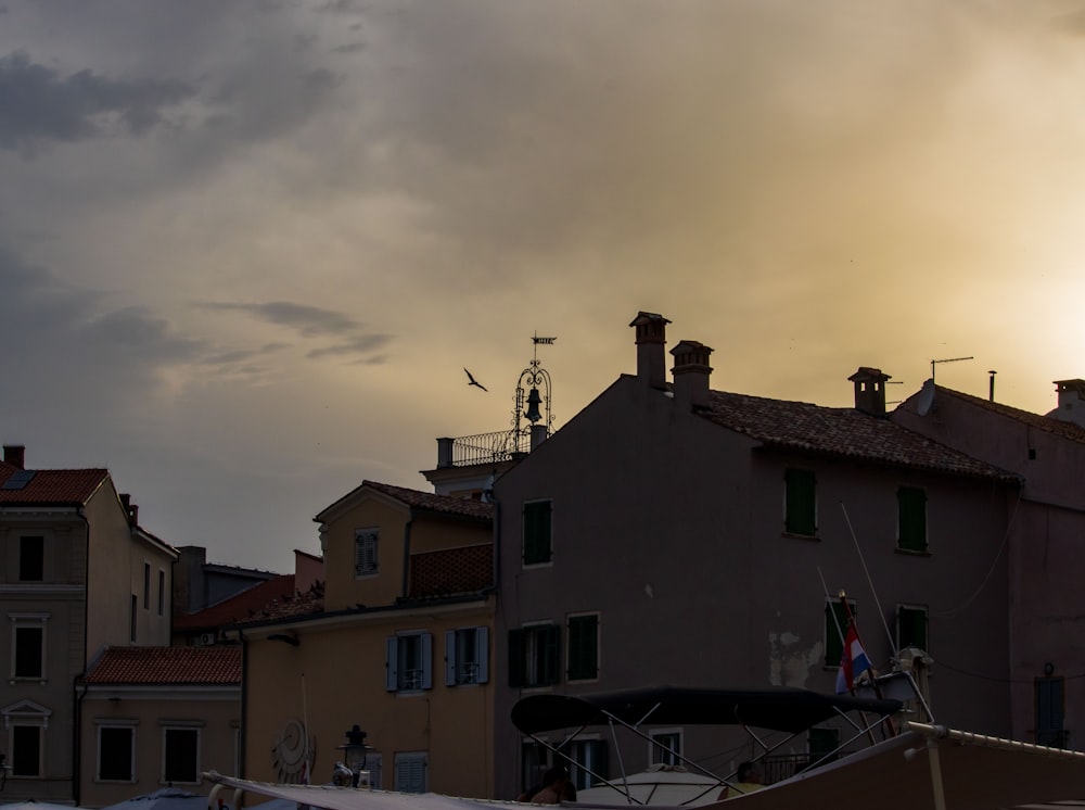 a group of buildings with a satellite dish on top