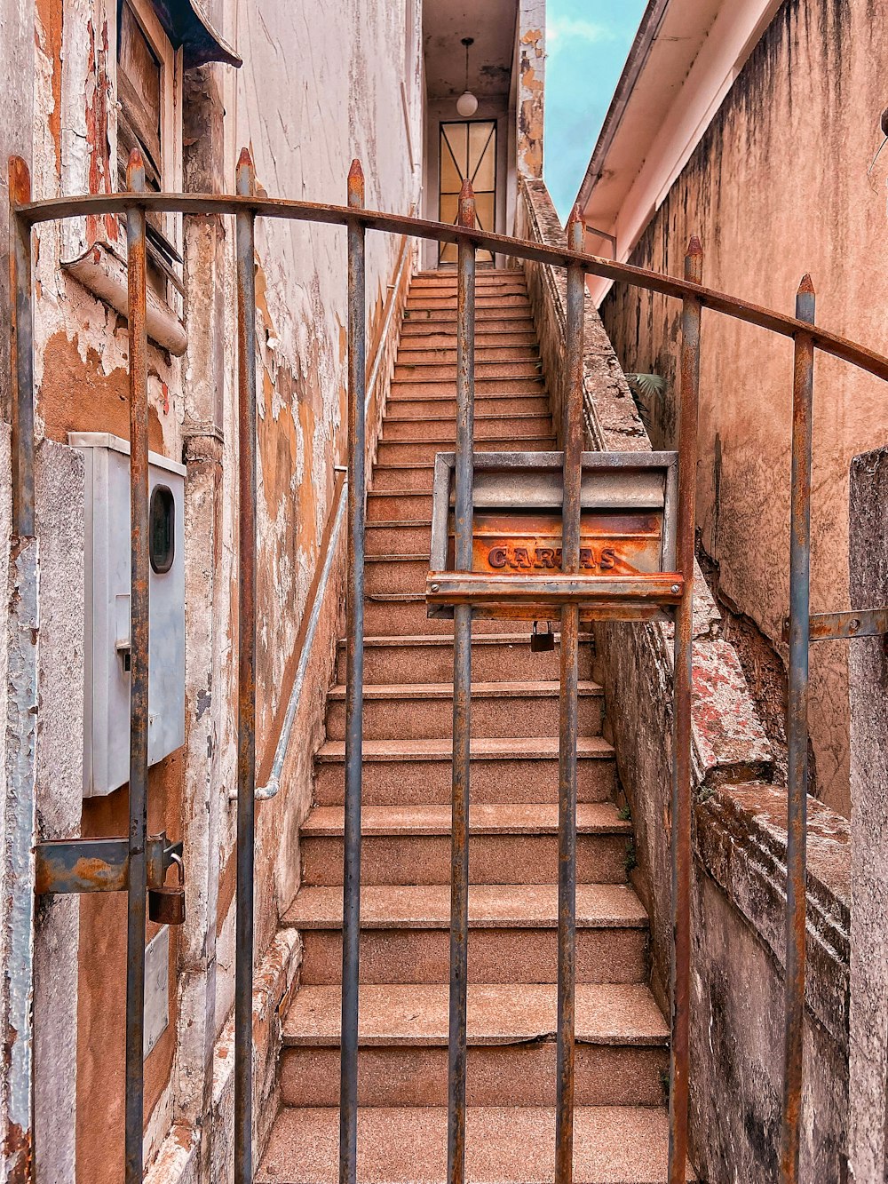 a wooden staircase in a brick building