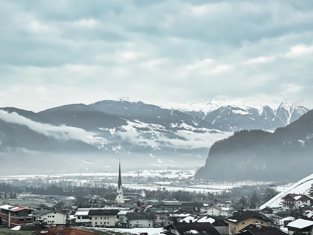 a city with snow covered mountains