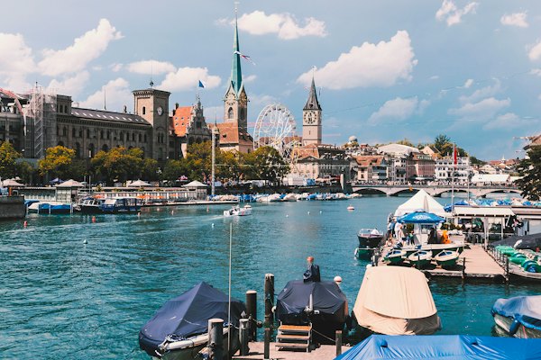 A body of water with boats and buildings in the background — Zurich, Switzerland