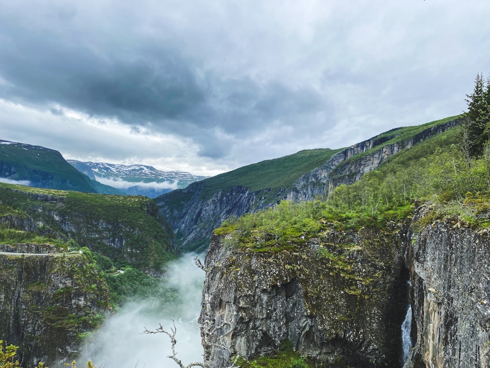 a waterfall in a valley