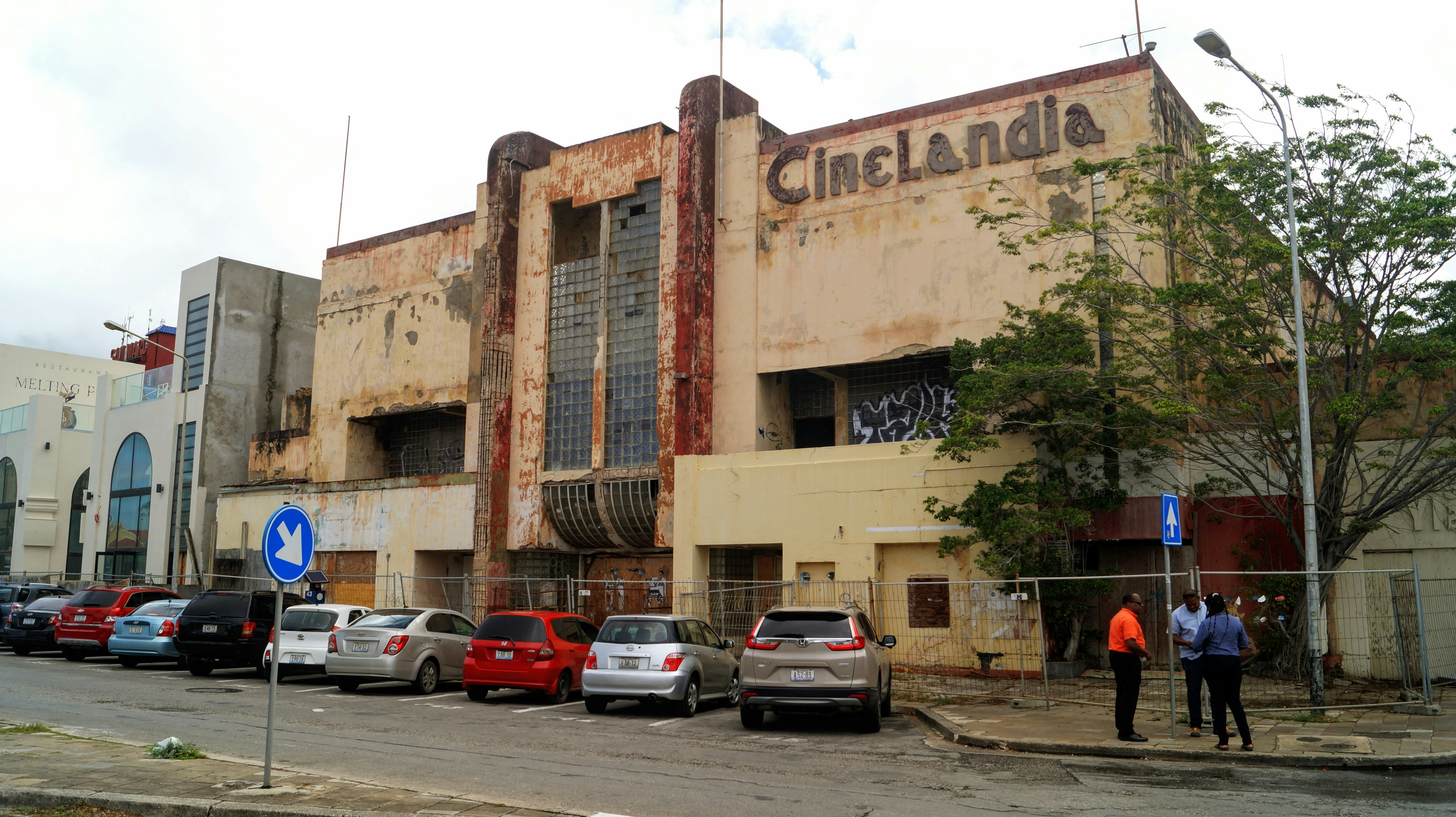 a building with cars parked in front