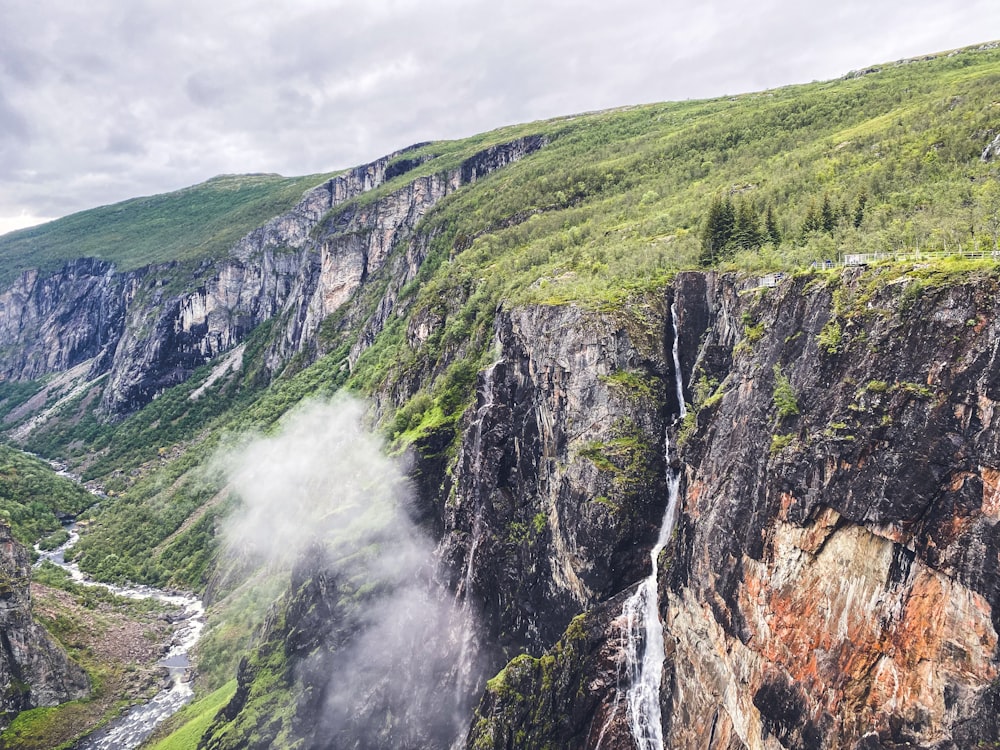 a waterfall in a mountain