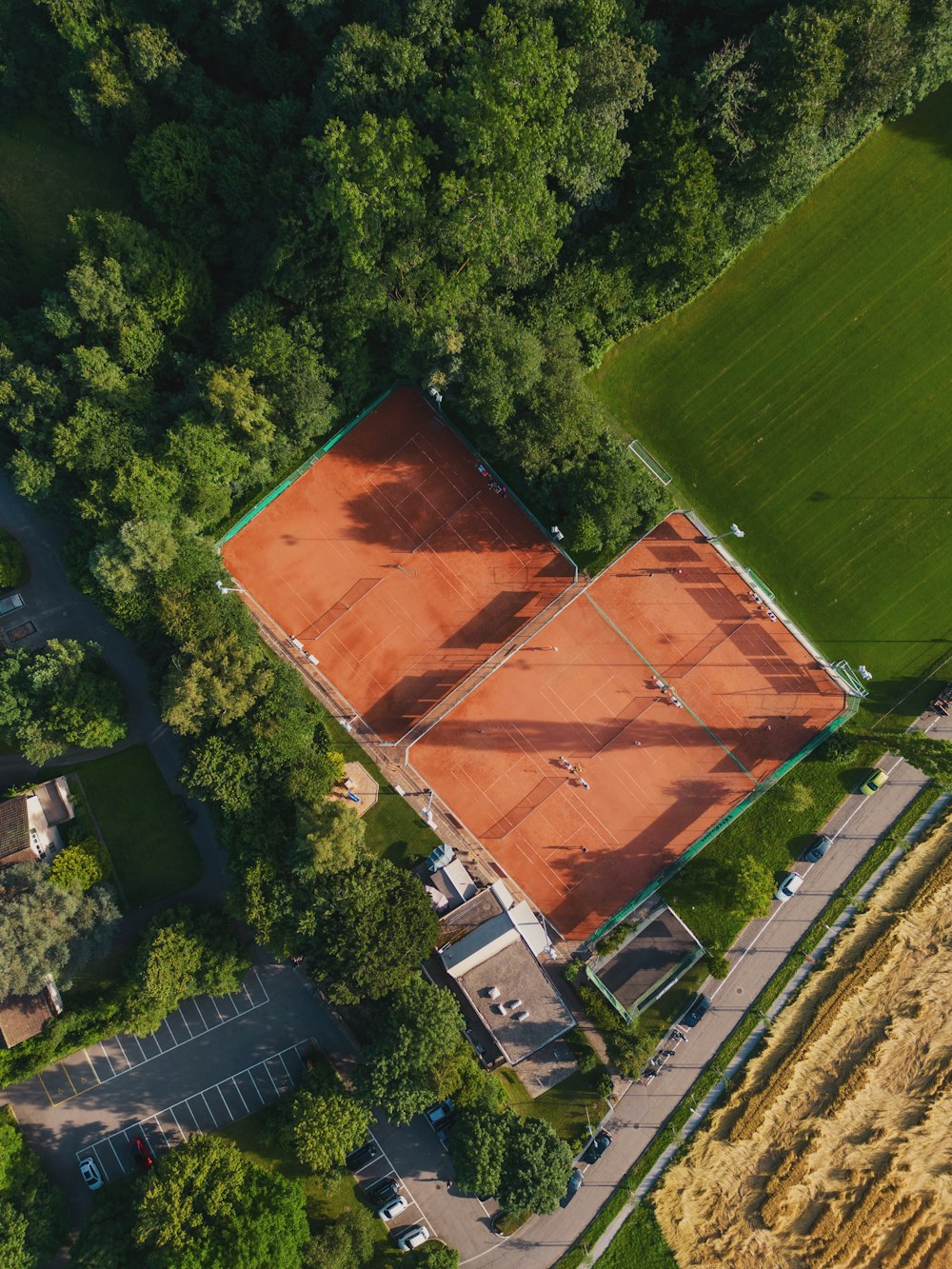 a building with a red roof surrounded by trees