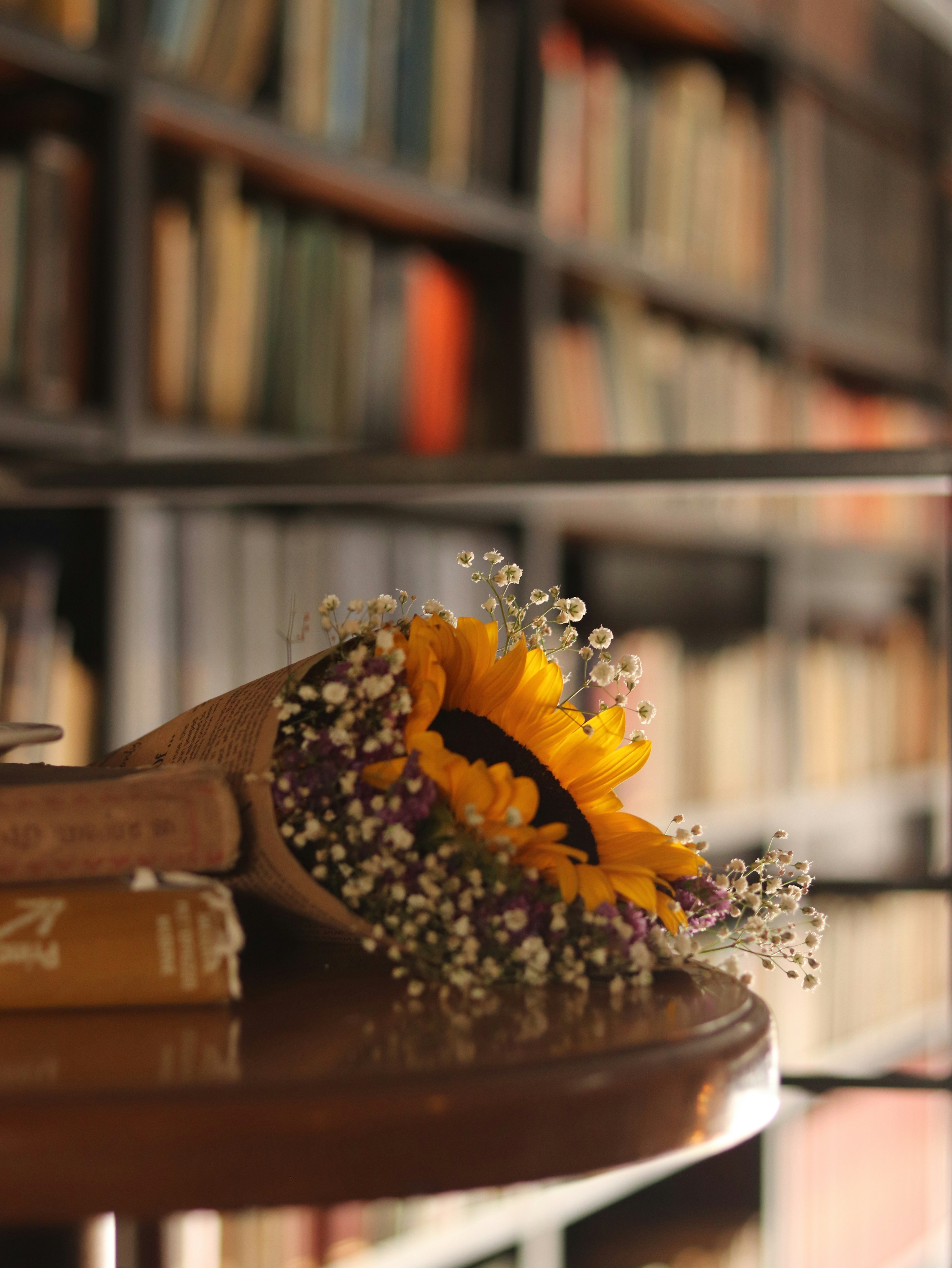 a yellow flower in a vase
