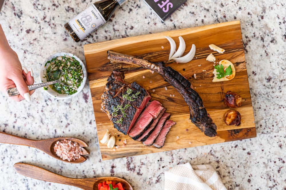 a wooden board with food on it