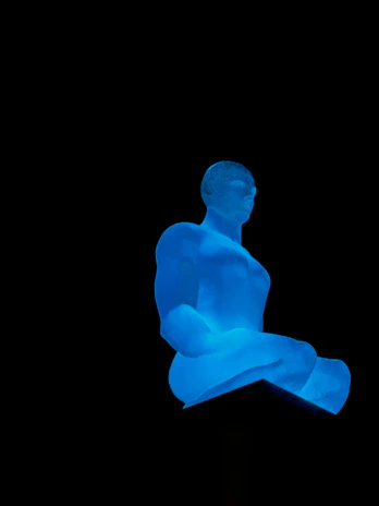 A glowing emerald and teal holographic figure meditating amidst a cosmic deep space background.