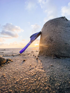 Pile of medium sand with a shovel on a sunny day.
