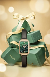 a watch on a green box