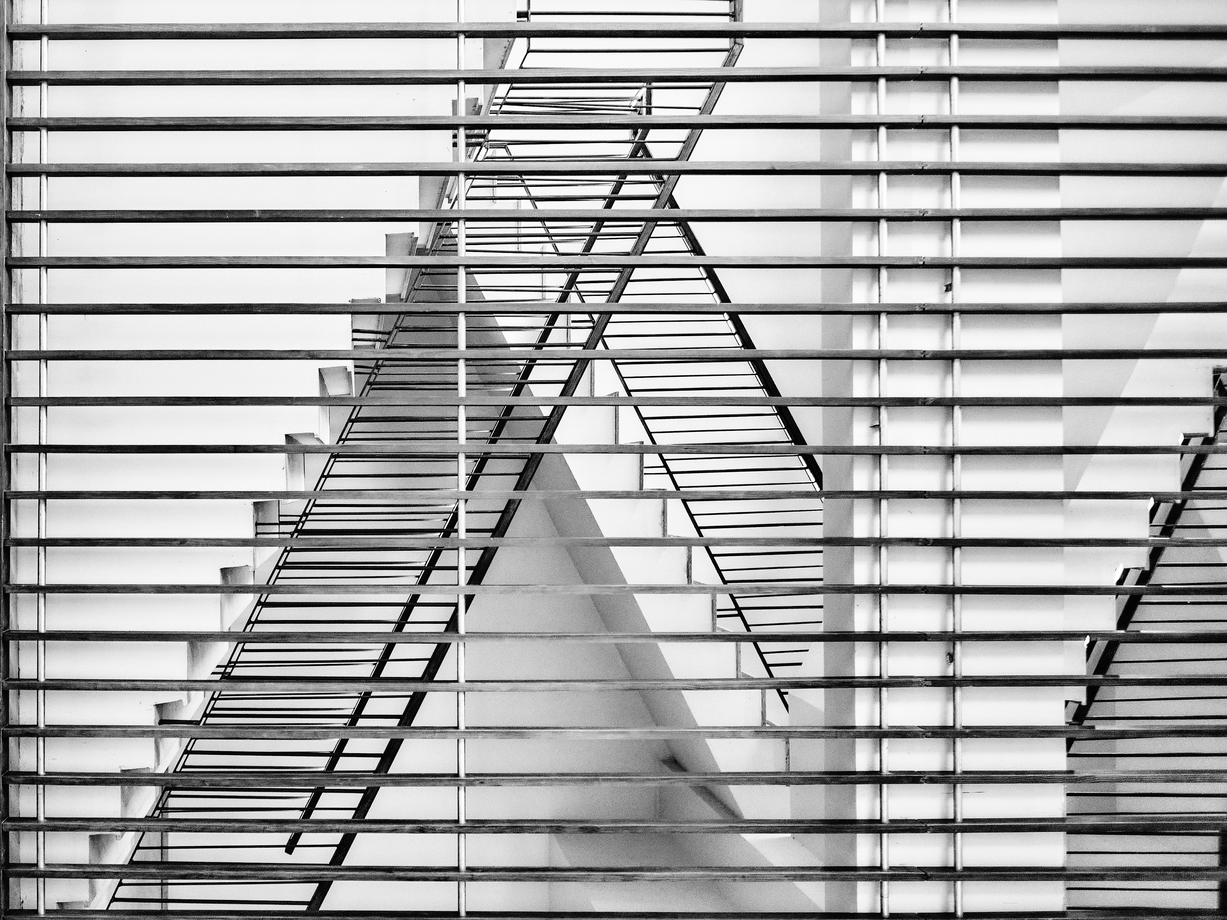a staircase with white walls