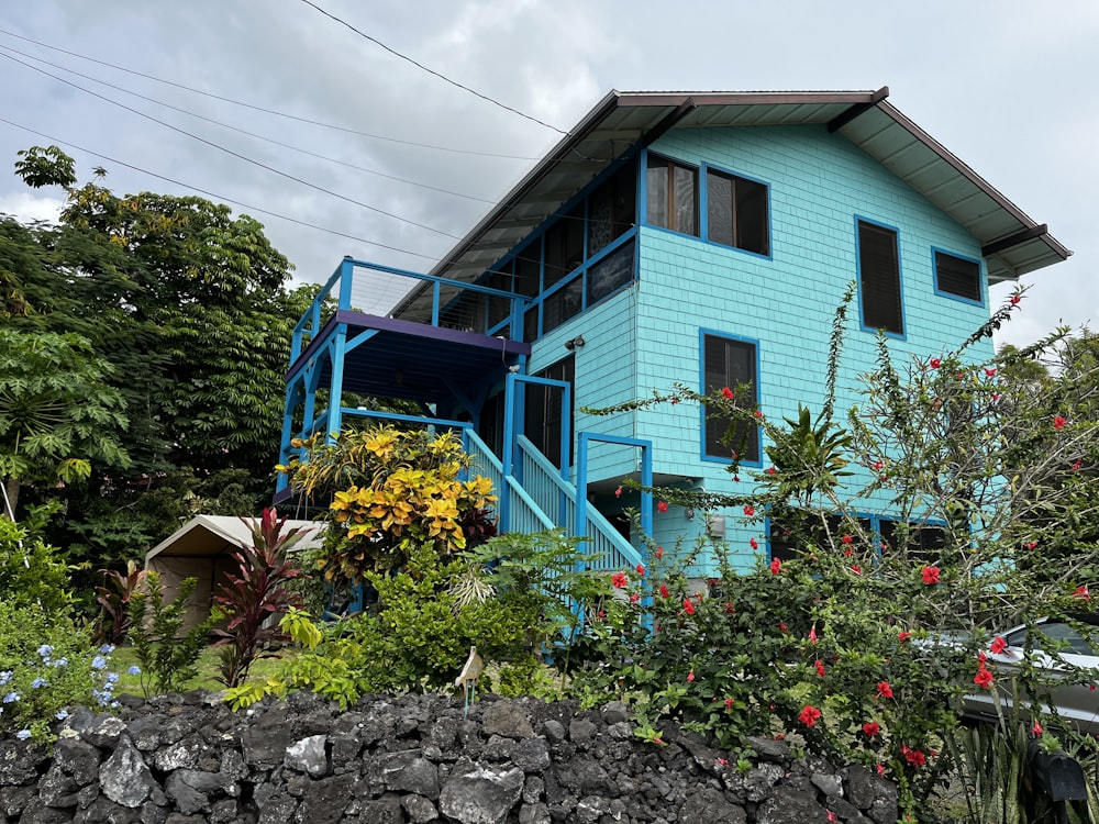 a blue house with a garden