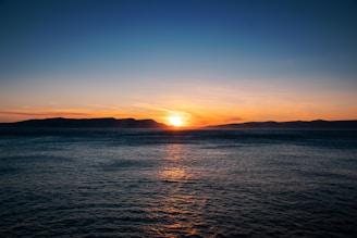 a sunset over a body of water