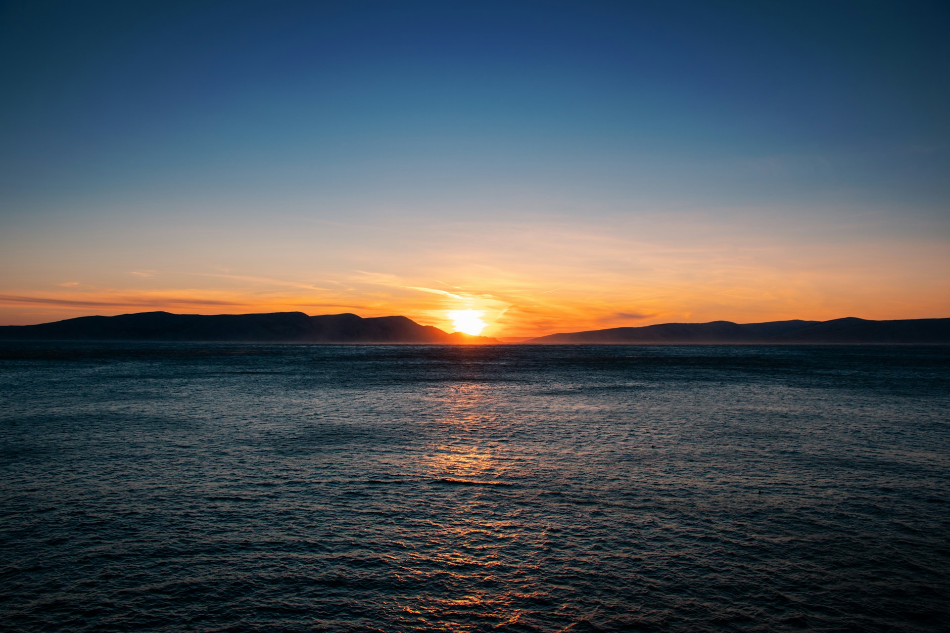 a sunset over a body of water