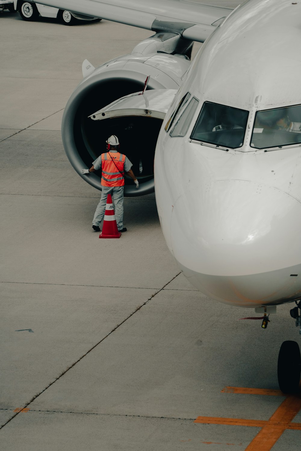 a person stands next to an airplane