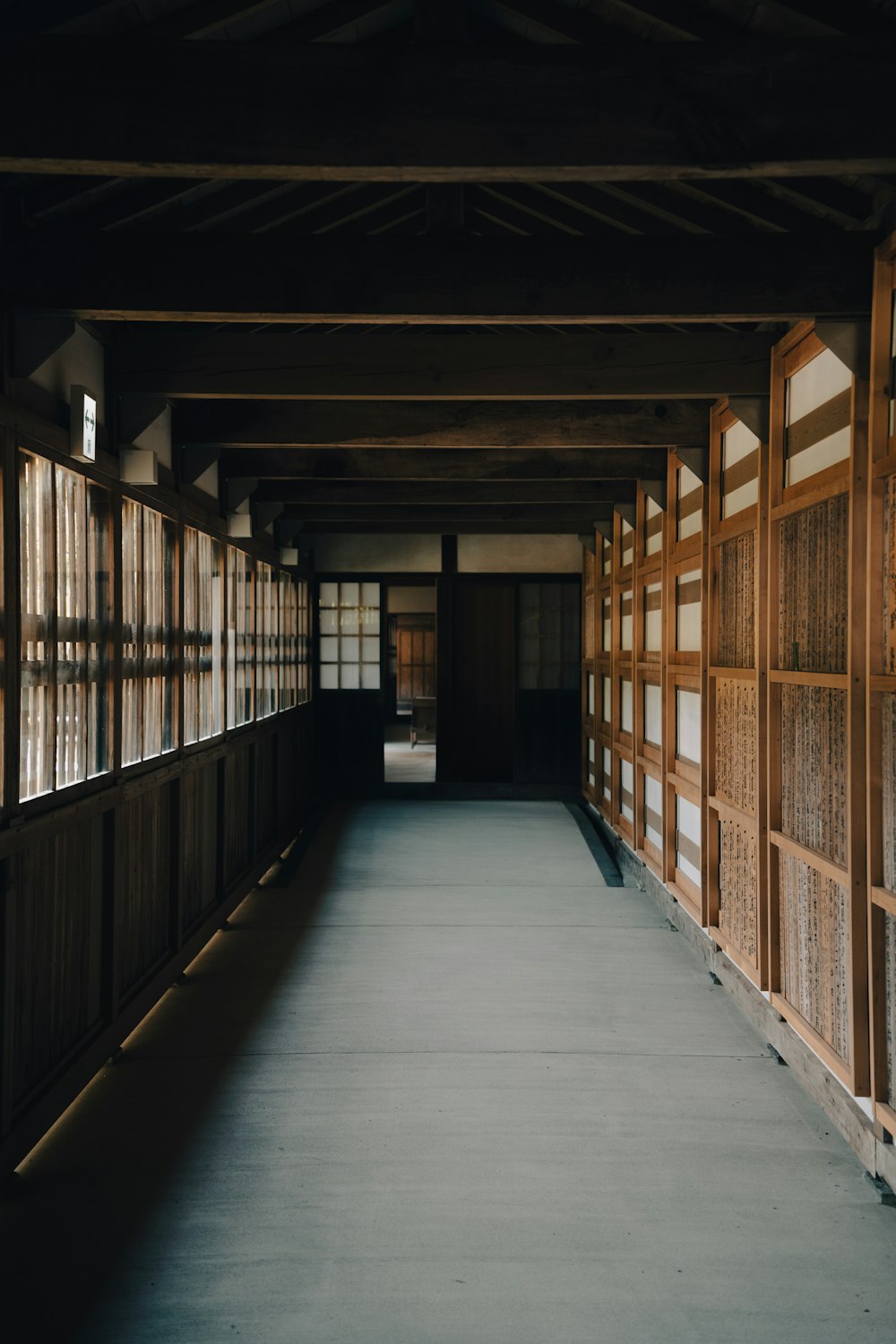 a long hallway with bookshelves