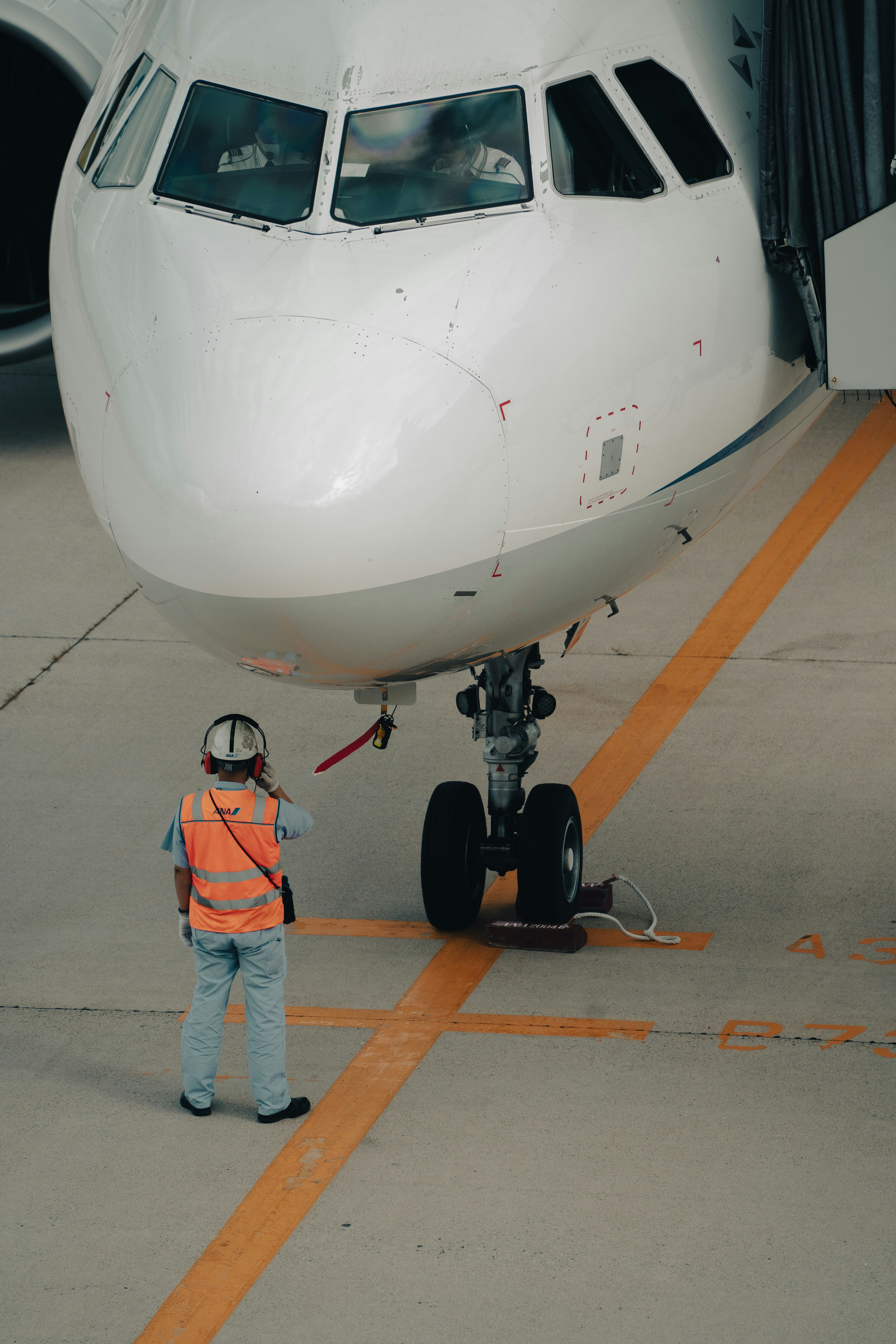 a person standing next to an airplane