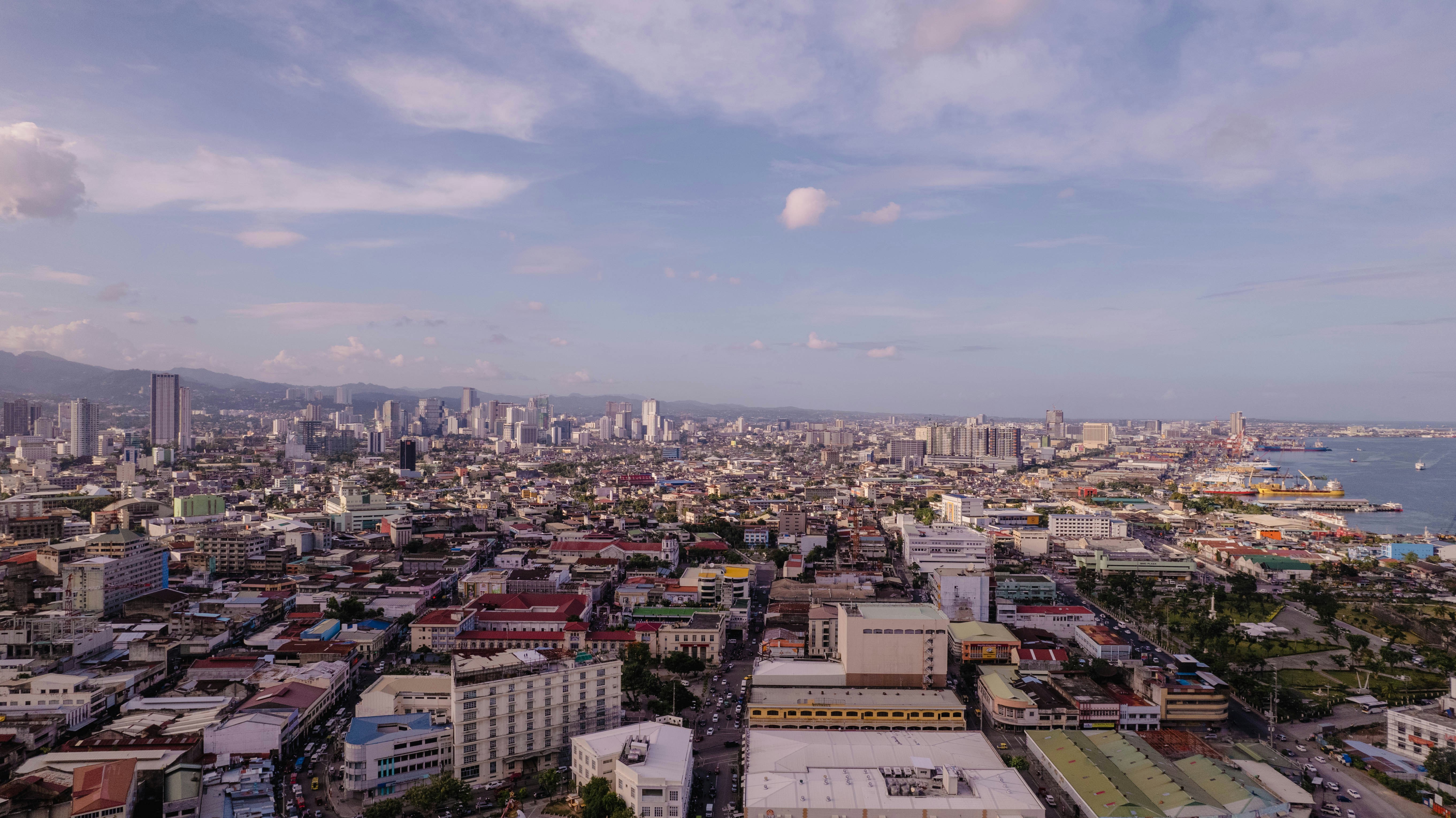 a city with a body of water in the background