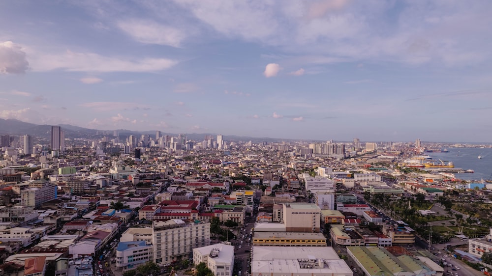 a city with a body of water in the background