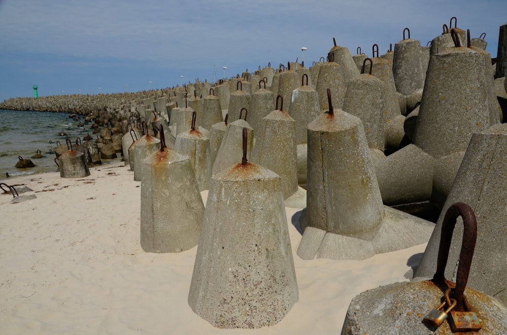 a group of stone structures on a beach