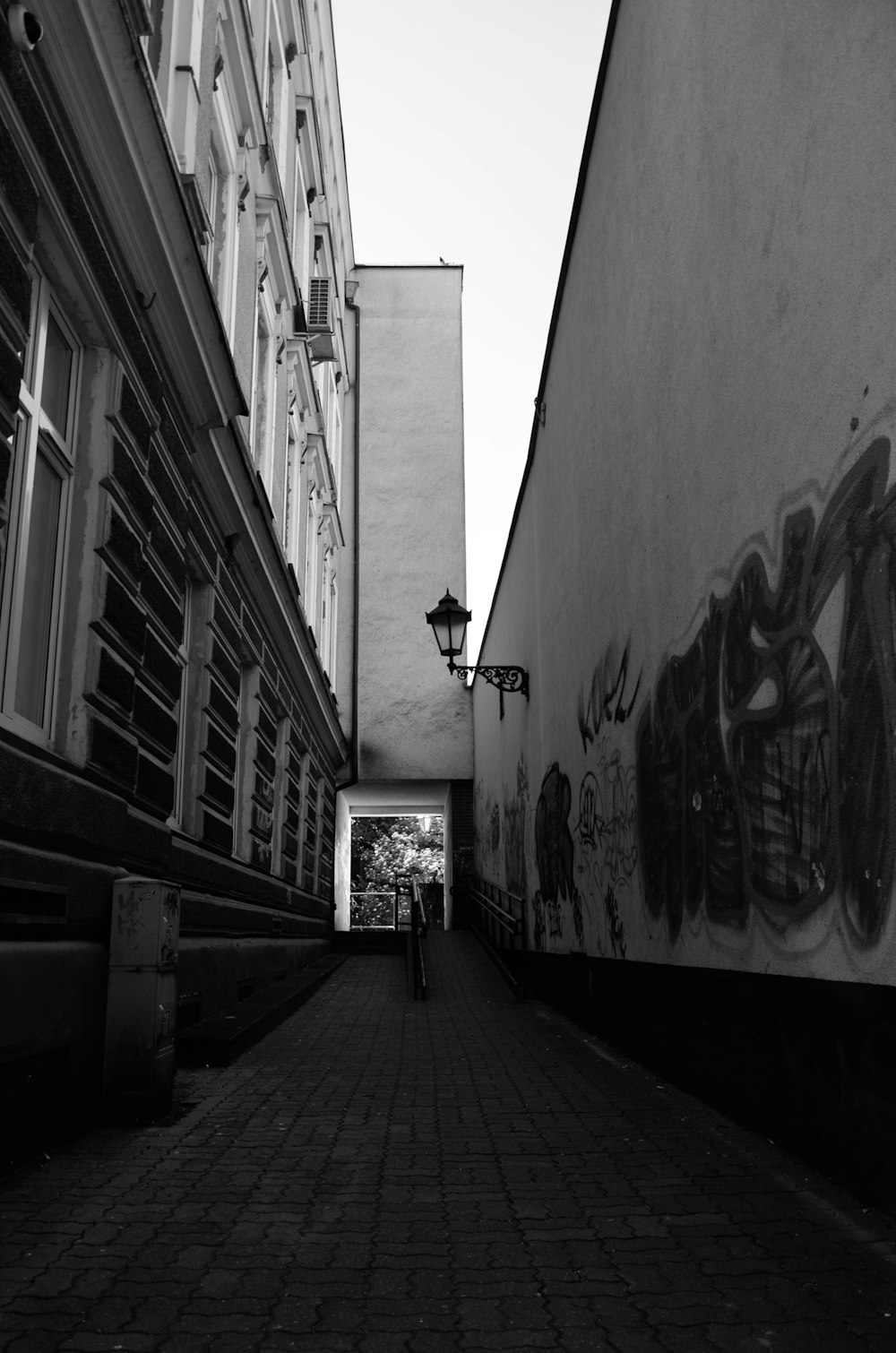 a brick walkway between buildings