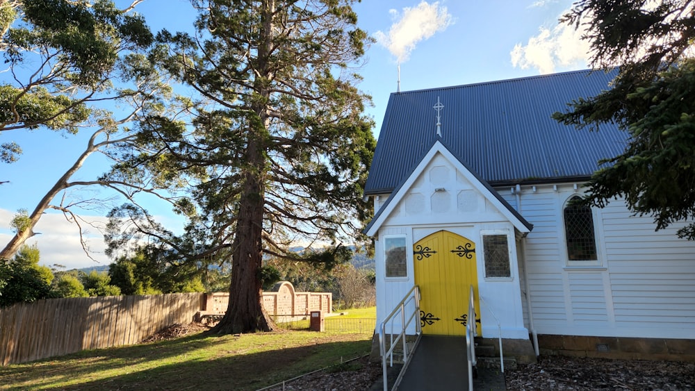 a small church with a yellow door