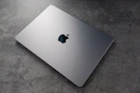 Side profile of a high-end laptop showcasing its slim, polished metal design.